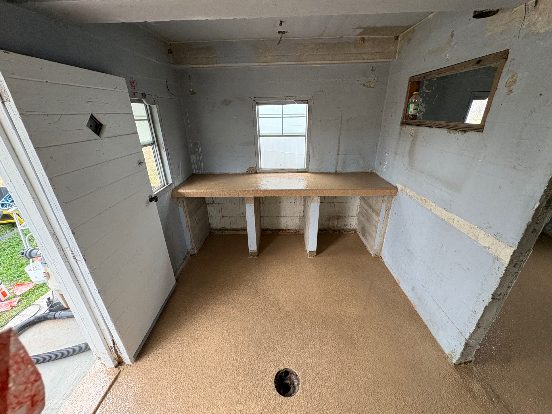 Full interior epoxy coating on floor and countertop of a hunting blind